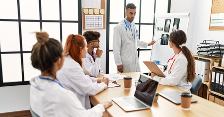Group of young doctor discussing in a medical meeting at the clinic office.