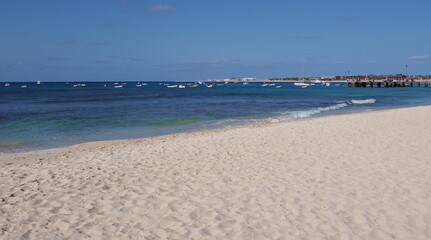 Scenic beach with pier on Atlantic Ocean at Sal island, Cape Verde
