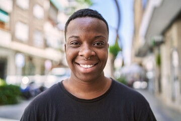 Young african american transgender smiling confident at street - obrazy, fototapety, plakaty