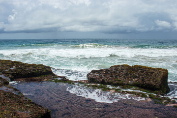 waves crashing on rocks