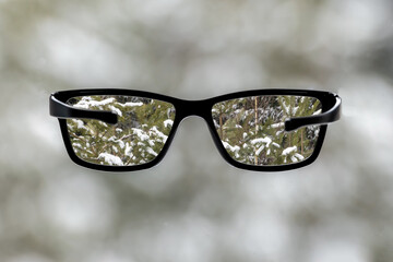 Glasses for vision with a sharp image in lenses on a blurred background. Reading Glasses. Classic...