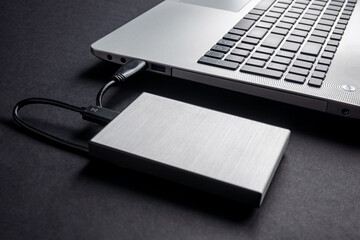 The hard drive is connected to the computer via a cable. Backup. Secret information.
