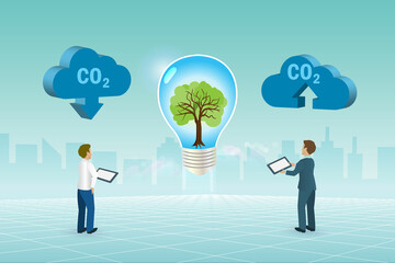 CO2 carbon emissions, earth day concept. Businessman growing tree in light bulb technology to reduce carbon emissions and sustainable positive environment.