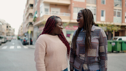 Two african american friends smiling confident standing together at street