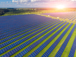 aerial view of solar panels on green lawn. drone shot,