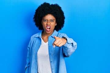 Fototapeta na wymiar Young african american woman wearing casual clothes pointing displeased and frustrated to the camera, angry and furious with you