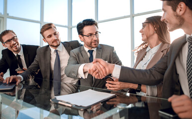 happy businessmen, handshake after the negotiations