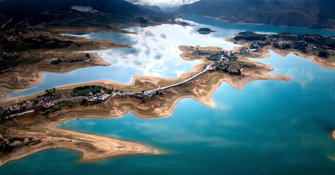 Aerial view of Rama Lake with a few buildings along the coast, Bosnia and Herzegovina.