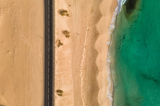 Aerial view of a beautiful beach along the road at Corralejo Natural Park, Fuerteventura, Canary Islands, Spain.