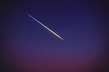 Stars, meteor trail on evening sky.
