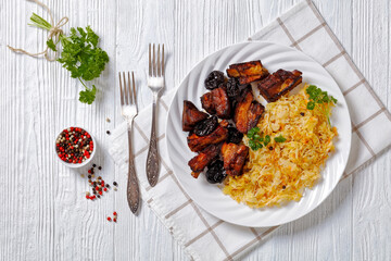 braised sauerkraut with pork and prunes on plate