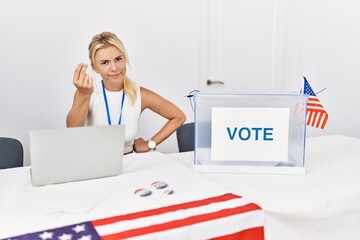 Young caucasian woman at america political campaign election doing italian gesture with hand and fingers confident expression