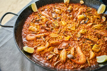  Delicious spanish shellfish paella on cloth surface