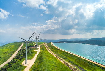 Aerial view of wind turbine and artificial lake, Mount Gilboa, Israel.