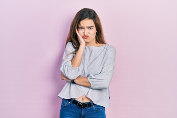 Young caucasian girl wearing casual clothes thinking looking tired and bored with depression problems with crossed arms.