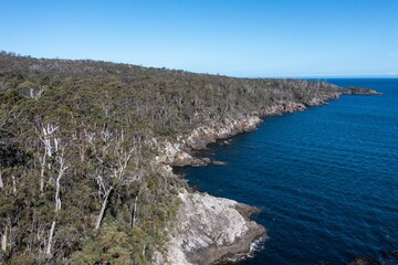 tasmanian coastal landscape in australia. aerial photos of rocky ocean views in southern tasmania. showing towns and farms.