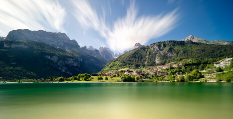 The village of Molveno and its lake. In the background the Brenta Dolomites. Trentino, Italy.