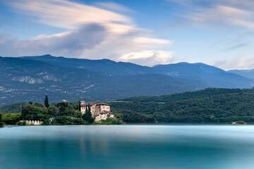 The medieval Stenico castle in the middle of the lake Toblino. Madruzzo, Trentino, Italy.