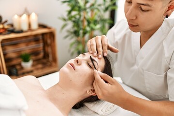 Woman reciving eyebrows treatment at beauty center.