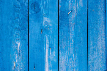 Fototapeta na wymiar blue painted wooden background with rusty old nails