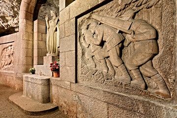 Doss Trento: the underground chapel of Santa Barbara, patron of miners, with the sculptures of the...