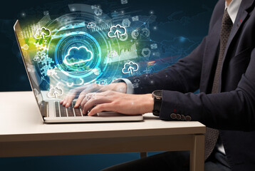 Business hand typing on a modern laptop