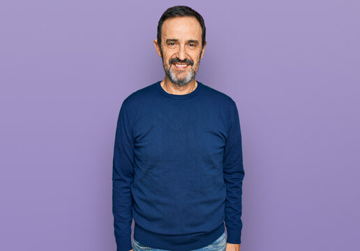 Middle age hispanic man wearing casual clothes with a happy and cool smile on face. lucky person.