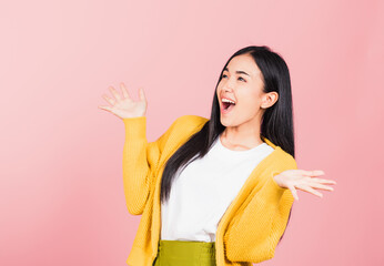 Happy Asian portrait beautiful cute young woman standing winning and surprised excited screaming open mouth raise hands, studio shot isolated pink background, Thai female wow with copy space - obrazy, fototapety, plakaty