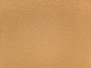 Fototapeta premium Rough plastered wall texture or background in light earthy tone