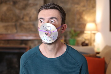 Comedian wearing antivirus cd protective mask