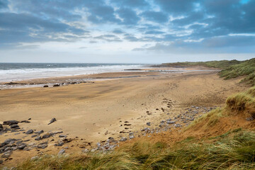 Stunning empty Fanore beach in county Clare, Ireland. Winter season. Beautiful cloudy sky. Nobody. Irish landscape.