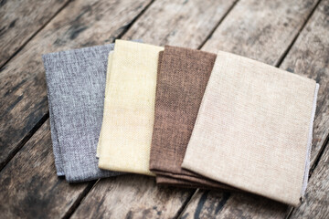 Close up group fabric on wood table.