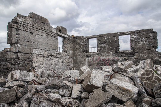 Low angle shot of stone ruins under a stormy sky in Iceland