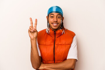 Young African American man isolated on white background showing number two with fingers.