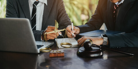 Business people and lawyers discussing contract papers sitting in the table at office in the morning. concepts of law, advice, legal services.