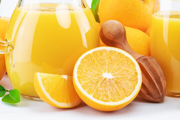 Yellow orange fruits and fresh orange juice isolated on white background. Close up.
