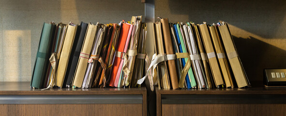 Document folders in an office. Panoramic view of many documents background. 