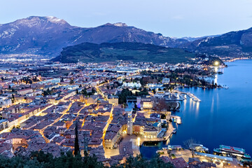 Twilight over the town of Riva and Lake Garda. Mount Stivo in the background. Trento province, Trentino Alto-Adige, Italy, Europe.