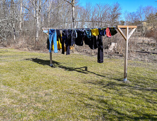 clothes hanging from drying rack in garden