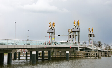 The city lift-bridge over the river IJssel in Kampen, the Netherlands, gold plated cable wheels