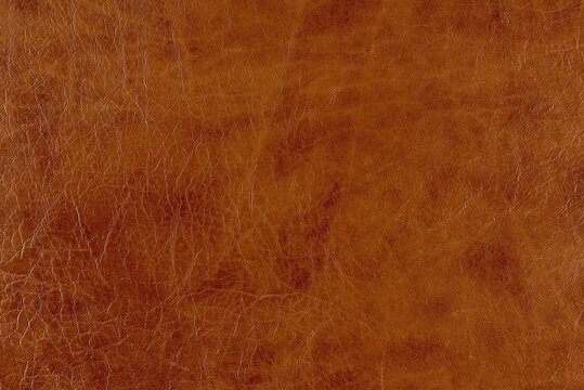 Closeup photo of abstract artificial brown leather background