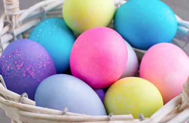 Fototapeta na wymiar Painted eggs in a basket