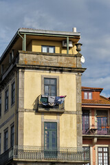 laundry hanging on a balcony of an old house in the Clérigos district of Porto, Portugal