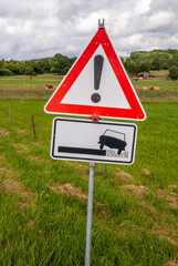 Vertical shot of road warning signs