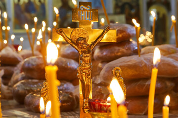 Funeral service, funeral liturgy in the Orthodox Church. Christians light candles in front of the...