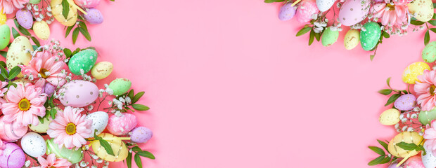 Colorful eggs with flowers on a pink background. Easter card with space for text. Spring banner