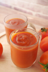  tomato sauce in a jar with fresh tomato on table 