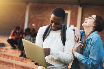 College - lots of learning and lots of fun. Shot of a young man and woman using a laptop together...