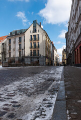 Cobblestone street with a little bit of snow in the Old Town Riga, Latvia