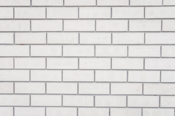 Fototapeta premium The wall is made of white brick. The background is made of gray brickwork